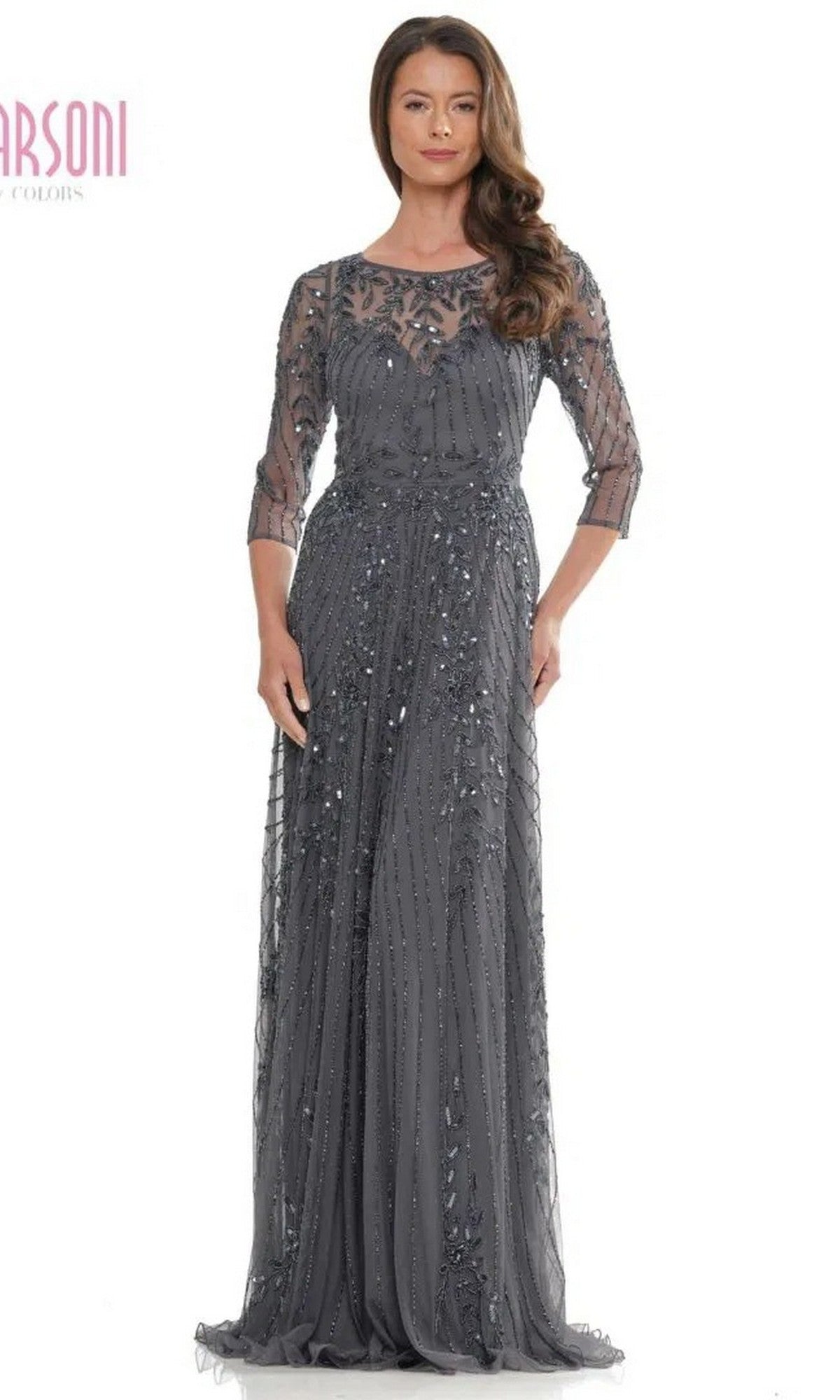 A woman wearing the Marsoni MV1283 long formal dress in charcoal with sequins and sheer three-quarter sleeves, standing and facing forward—ideal as a formal gown or for the mother of the bride.